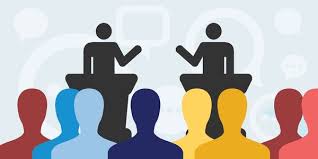 Candidate forum – speakers at podiums addressing an audience