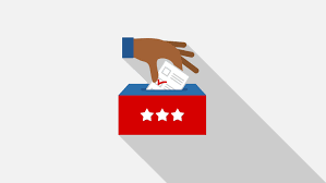 Hand casting a ballot into a ballot box
